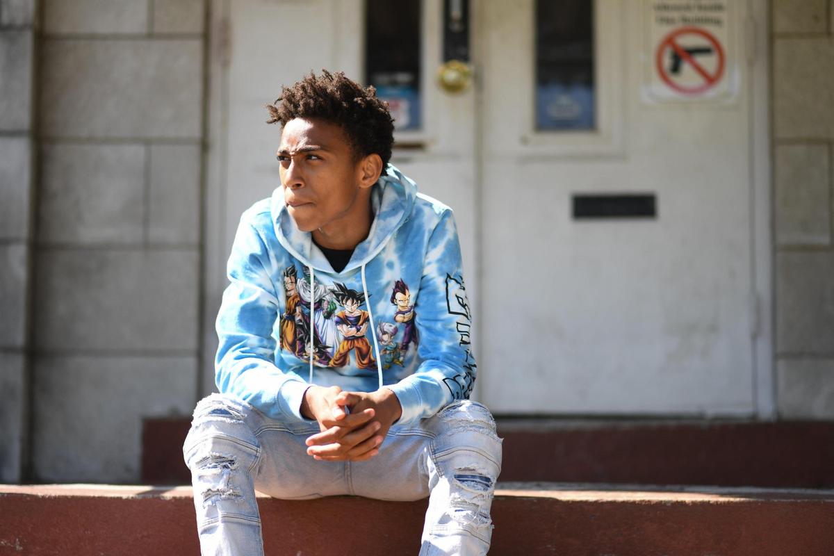 Christian Rich, 15, poses for a portrait outside the Sankofa Training Center in St. Louis.