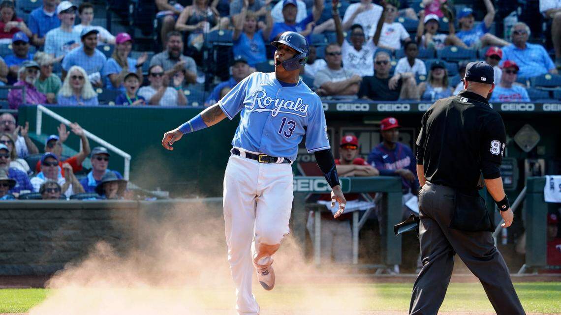 The Royals’ Salvador Perez reacts after scoring on a Hunter Dozier sacrifice fly during the fifth inning against the Minnesota Twins on Saturday, July 3, 2021, at Kauffman Stadium in Kansas City, Mo.