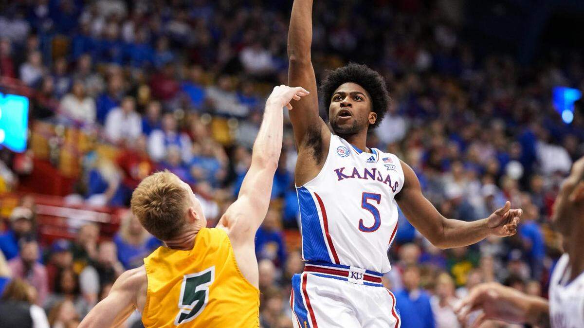 Kansas Jayhawks guard Kyle Cuffe Jr. (5) shoots against North Dakota State Bison guard Luke Yoder (5) during the second half at Allen Fieldhouse on Nov. 10, 2022.