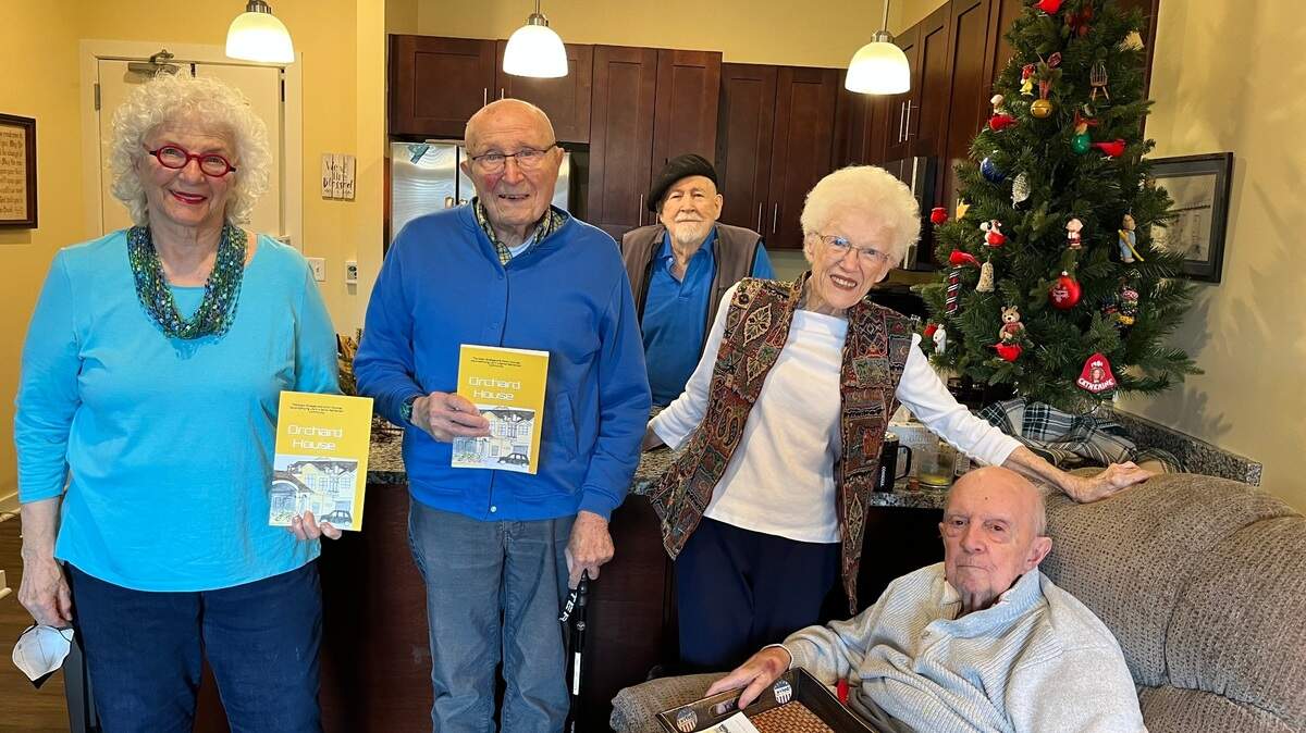 The creators of “Orchard House: The Major Stresses and Minor Victories Accompanying Life in a Senior Retirement Community” are (from left): Carolynn Fischel, who created the cover, and authors Robert Karsh, Robert Blanc, Shirley Richards and Leonard Jackson. Their book is available on Amazon.