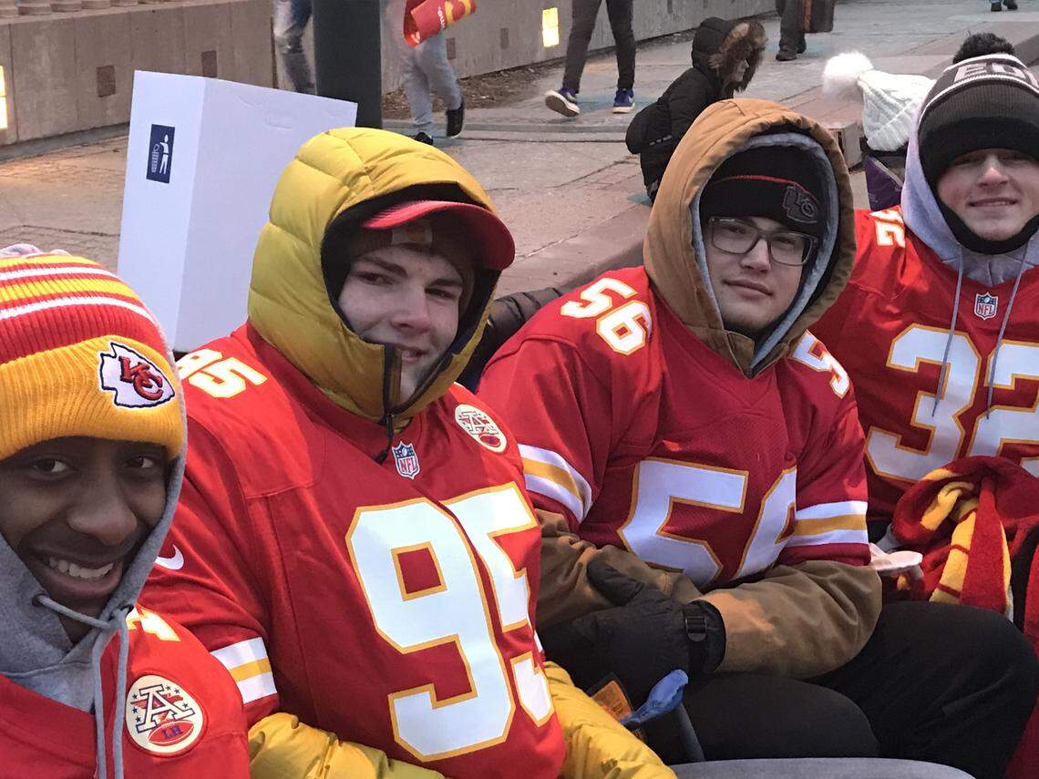 M.J. Ringstad, from left, Bennett Jones, Evan Jurad and Logan Hansen arrived downtown at 3 a.m., bundled up against the cold, to watch the Chiefs Super Bowl victory parade.