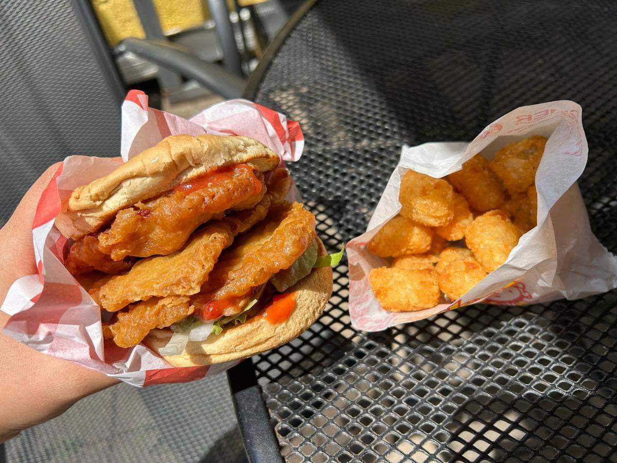 The pork tenderloin sandwich with a side of tater tots is the perfect grab-and-go lunch.