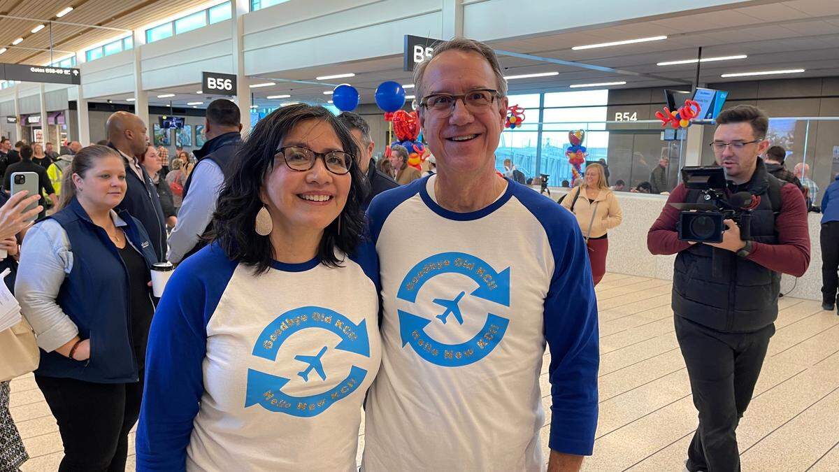 Jere Sellers said he was puzzled when his wife Veronica said she wanted to book seats on the last flight out of the old KCI terminals and the first flight into the new one. But she talked him into it, saying it was a once in a lifetime thing. Then even had matching t-shirts made for the occasion.