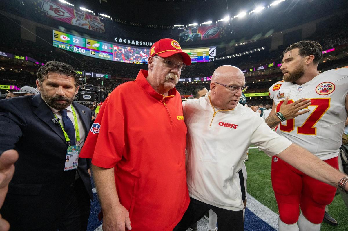 Chiefs head coach Andy Reid and Kansas City Chiefs tight end Travis Kelce (87) walk off the field after Chiefs lost to the Philadelphia&nbsp;Eagles, 40-22, in Super Bowl LIX on Sunday, Feb. 9, 2025, in New Orleans.