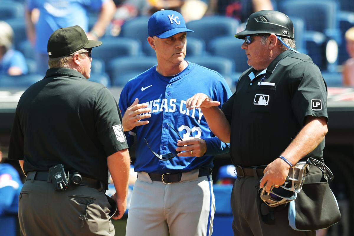 Kansas City Royals manager Matt Quatraro chats with umpires Marvin Hudson, left, and Hunter Wendelstedt during Monday’s game against the Cleveland Guardians at Progressive Field.