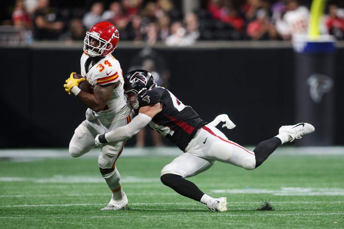 Kansas City Chiefs running back Samaje Perine is tackled by Atlanta Falcons linebacker Troy Andersen during Sunday night’s game at Mercedes-Benz Stadium.