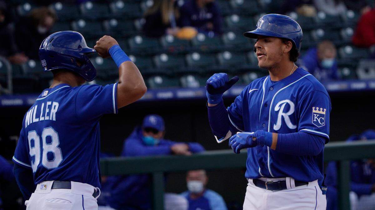 Kansas City Royals’ Nick Pratto, right, celebrates his home run with teammate Anderson Miller (98) in the sixth inning of a spring training baseball game against the Chicago Cubs, Saturday, March 13, 2021, in Surprise, Ariz. (AP Photo/Sue Ogrocki)