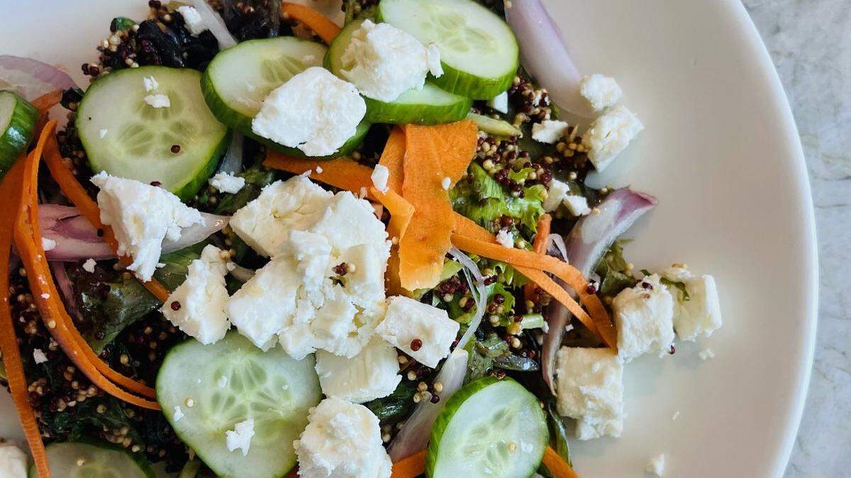Panacea’s couscous quinoa salad with shaved Brussels sprouts, red cabbage, carrots, feta, tomato, cucumber, onion, pumpkin seeds and tahini black garlic vinaigrette.