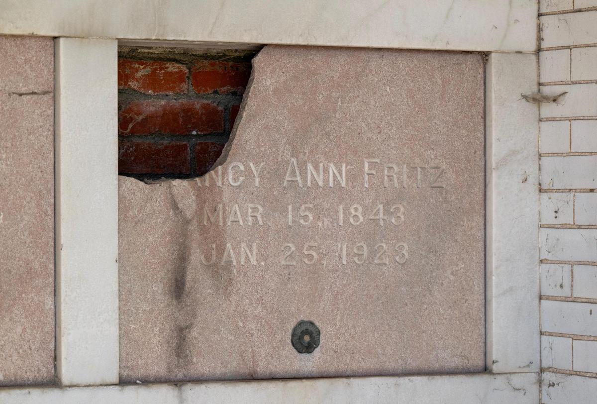 Damage to a memorial plaque inside a mausoleum was visible on at the historic Elmwood Cemetery on Tuesday, April 8, 2025, in Kansas City.