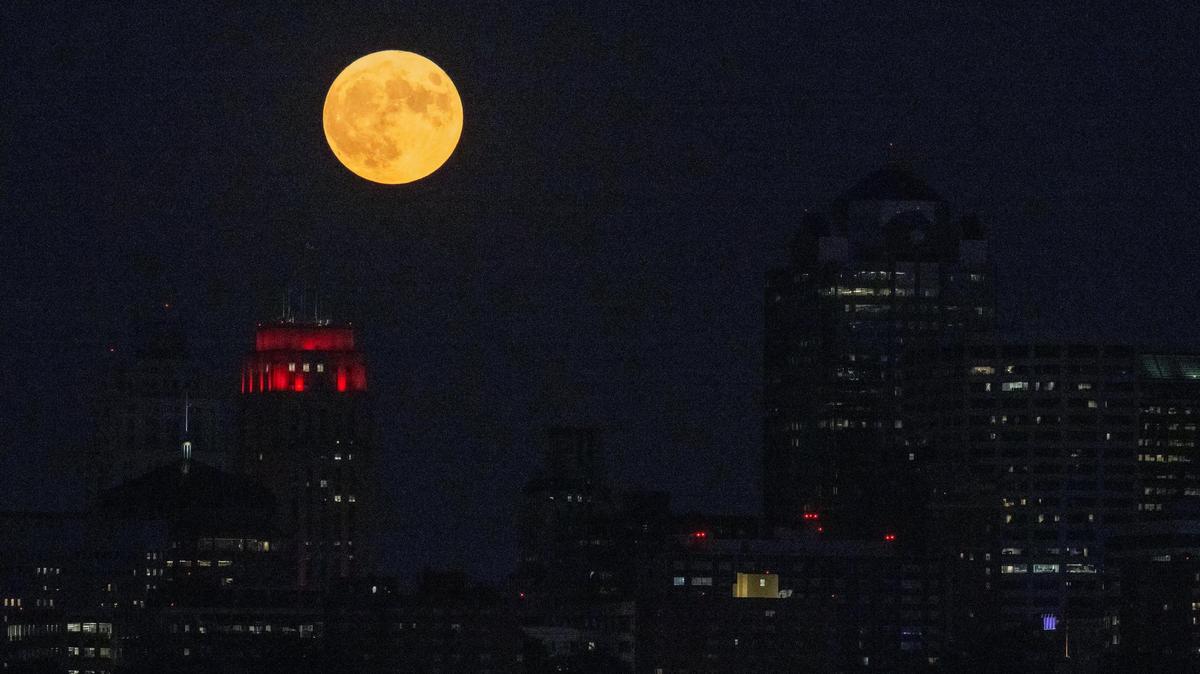A supermoon is seen over the Kansas City skyline on Aug. 30, 2023. The bigger moons appear a few times a year.
