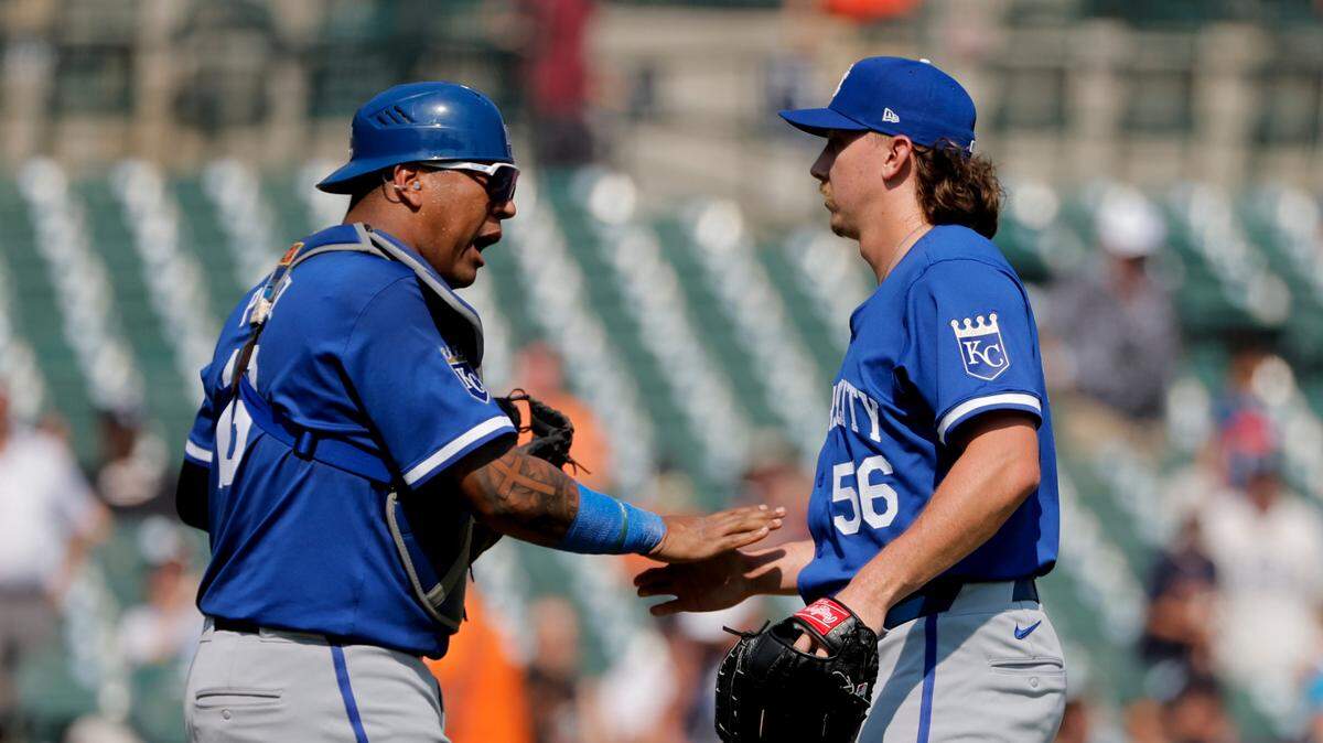 Kansas City Royals catcher Salvador Perez (13) and pitcher Hunter Harvey (56) celebrate after defeating the Detroit Tigers at Comerica Park. on Aug. 4, 2024, in Detroit.