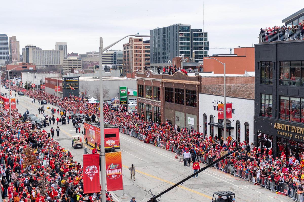 Kansas City Chiefs fans cheer as the team progresses down Grand Boulevard during the Super Bowl victory parade on Wednesday, Feb. 15, 2023. Messenger Coffee expects to do booming business again, inside and on the roof.