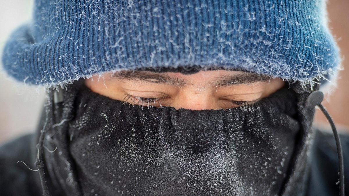 Edson Palacios braved the sub-zero temperatures which caused his eyelashes to become covered in ice as he worked to clear the sidewalks Tuesday, Feb. 16, at Colonial Church in Prairie Village.