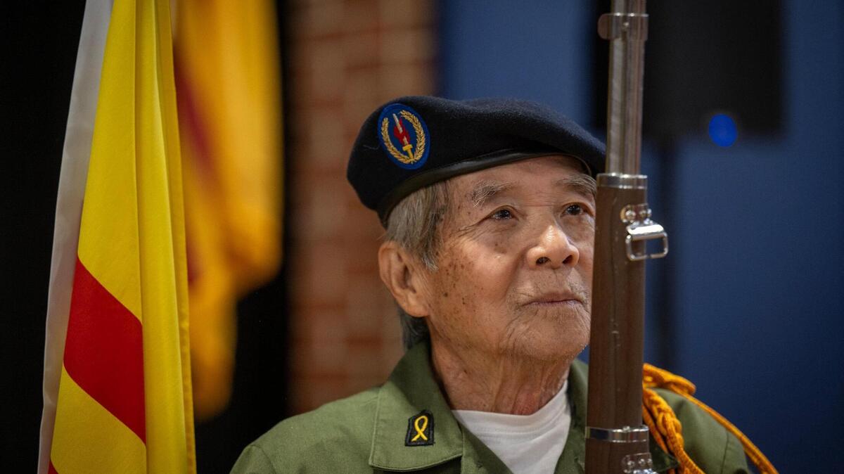 Ho Huynh, 77, of Overland Park, held the rifle steady as he prepared for “Remembering Saigon,” a commemorative event held Sunday, May 4, 2025, at the Don Bosco Community Center in Kansas City. The event marked the 50th anniversary of the end of the Vietnam War and the resulting mass exodus of South Vietnamese individuals, many of whom, including Huynh, settled in Kansas City. Huynh, who was a member of the South Vietnamese Army, was held for seven years in a “re-education” camp.