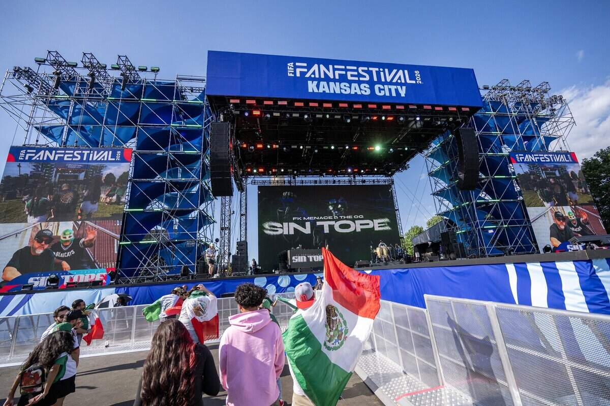 People dance as Sin Tope performs at FIFA Fan Festival on Thursday, June 11, 2026, in Kansas City.