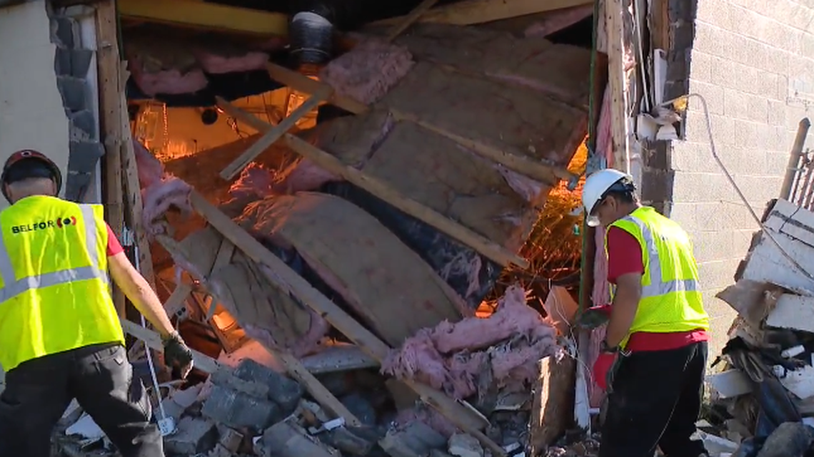 A garbage truck crashed into a building in Sterling Heights, Michigan, and marijuana grow farm was discovered during the accident investigation, police said. Screengrab from WJBK.