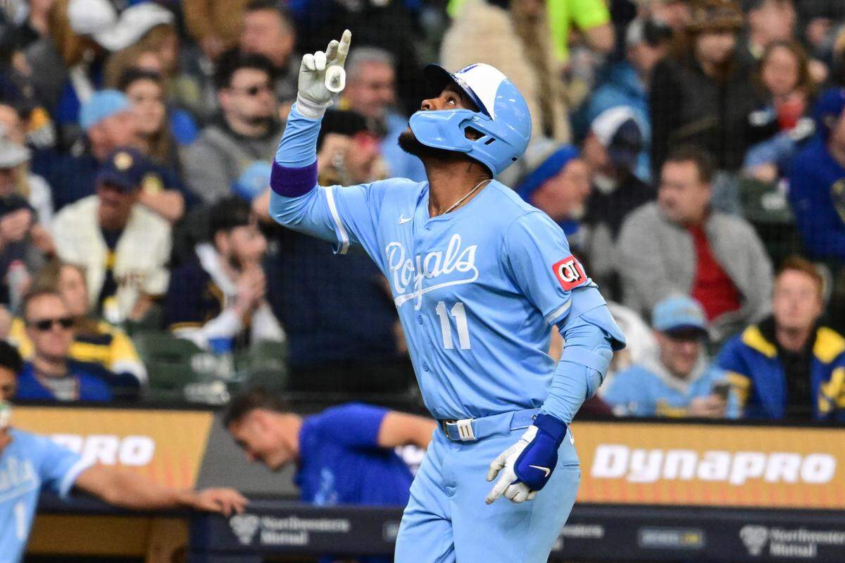 Kansas City Royals center fielder Maikel Garcia points skyward after hitting a solo home run in the second inning of a Major League Baseball game against the Brewers at American Family Field in Milwaukee, Wisconsin, on Monday, March 31, 2025.