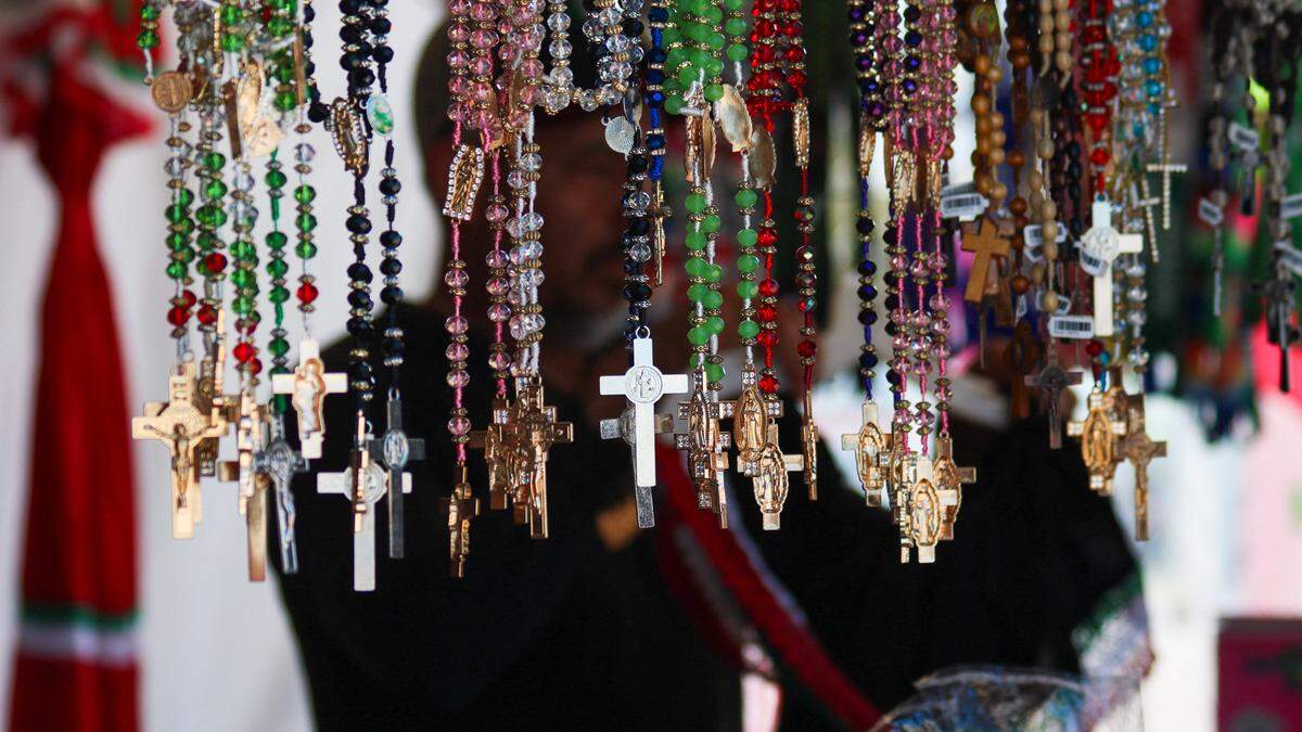 Necklaces and Rosaries hang from a vendor booth at Fiesta Hispana on Sept. 13, 2025. The three-day event celebrates Hispanic heritage.