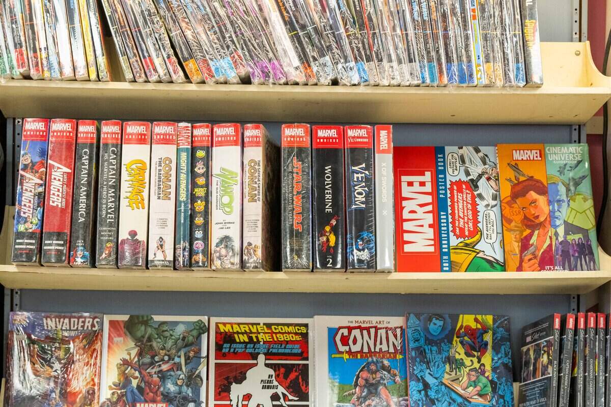 Various comic books line the shelves at the new location of Clint's Comics in Independence on Tuesday, January 7, 2026. Clint's Comics was previously located in Midtown Kansas City before the ceiling collapsed on the building it occupied.