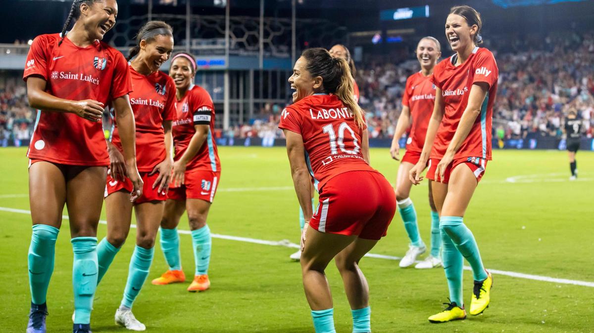KC Current midfielder Lo’Eau Labonta (No. 10) dances with her teammates after converting a penalty kick for the tying score against Angel City FC on Friday night at Children’s Mercy Park in Kansas City, Kan.