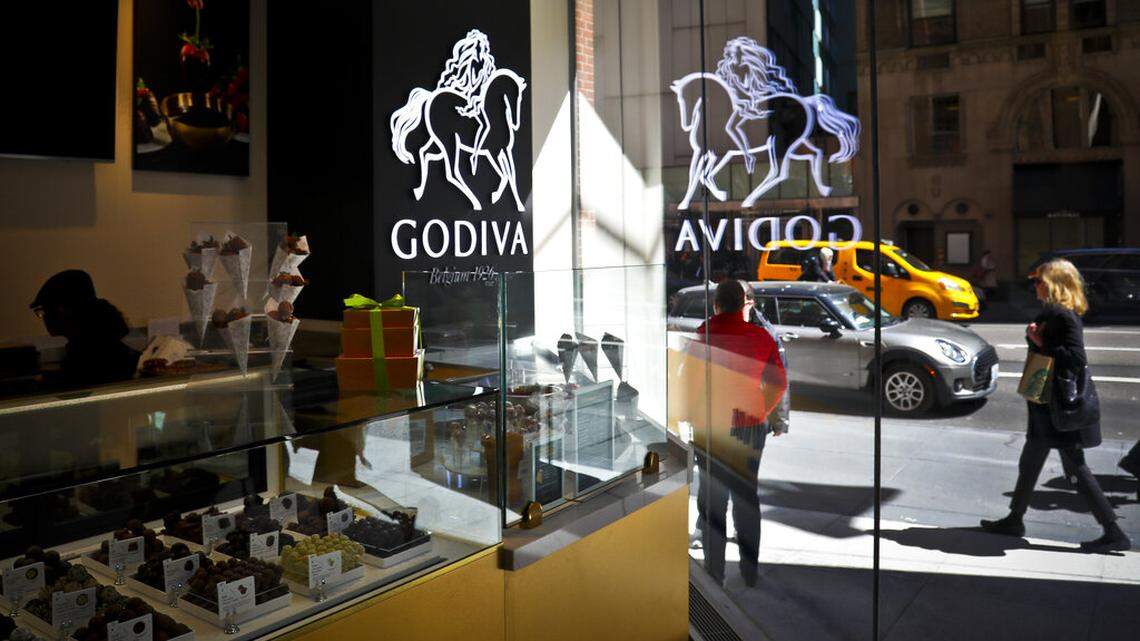 A display of chocolate treats is displayed at Godiva’s cafe in New York, Tuesday April 16, 2019. Godiva, the private Belgium chocolate maker, is closing all its stores in North America. (AP Photo/Bebeto Matthews)