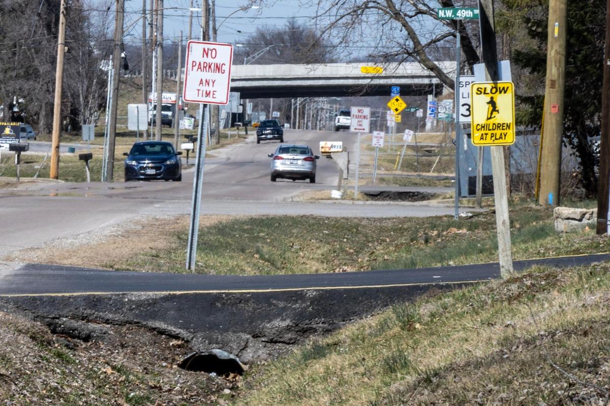 A sign warning drivers to slow down for children is seen along Northwest Waukomis Drive on Wednesday, March 12, 2025, in Northmoor.