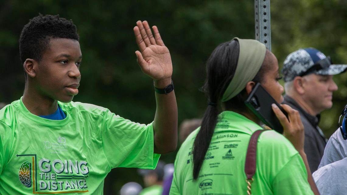 Ralph Yarl, the Staley High School teen shot in the head in April for ringing the wrong doorbell, waved at runners in the 5 and 10k run during the Going the Distance for Brain Injury Annual run,Memorial Day, May 29, 2023 at Loose Park. Yarl and family members participated in the 1.5K walk.