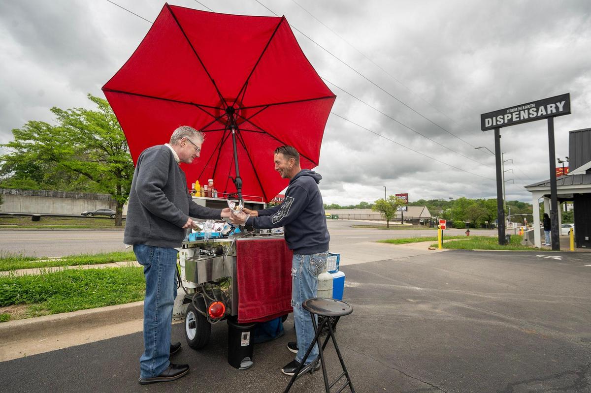Tom Coffmann of Mission, Kansas, purchasing a hot dog on a recent Wednesday afternoon. 