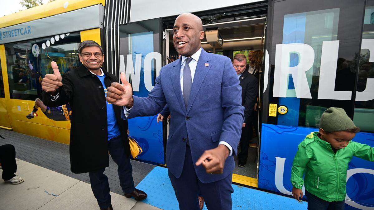 UMKC Chancellor C. Mauli Agrawal, left, and Kansas City Mayor Quinton Lucas step off a streetcar after riding during an inaugural run on Friday, Oct. 24, 2025, during the grand opening celebration for the KC Streetcar extension in Kansas City.