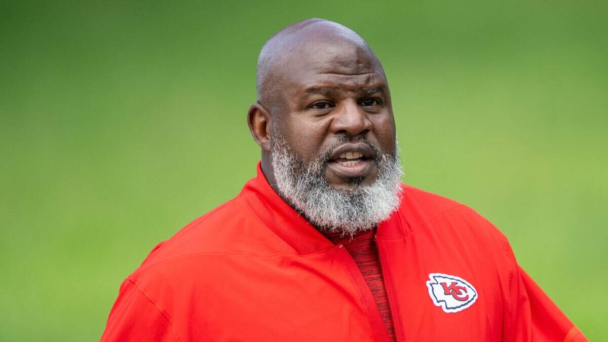 Kansas City Chiefs offensive coordinator Eric Bieniemy walks toward the practice field at Chiefs training camp on Sunday