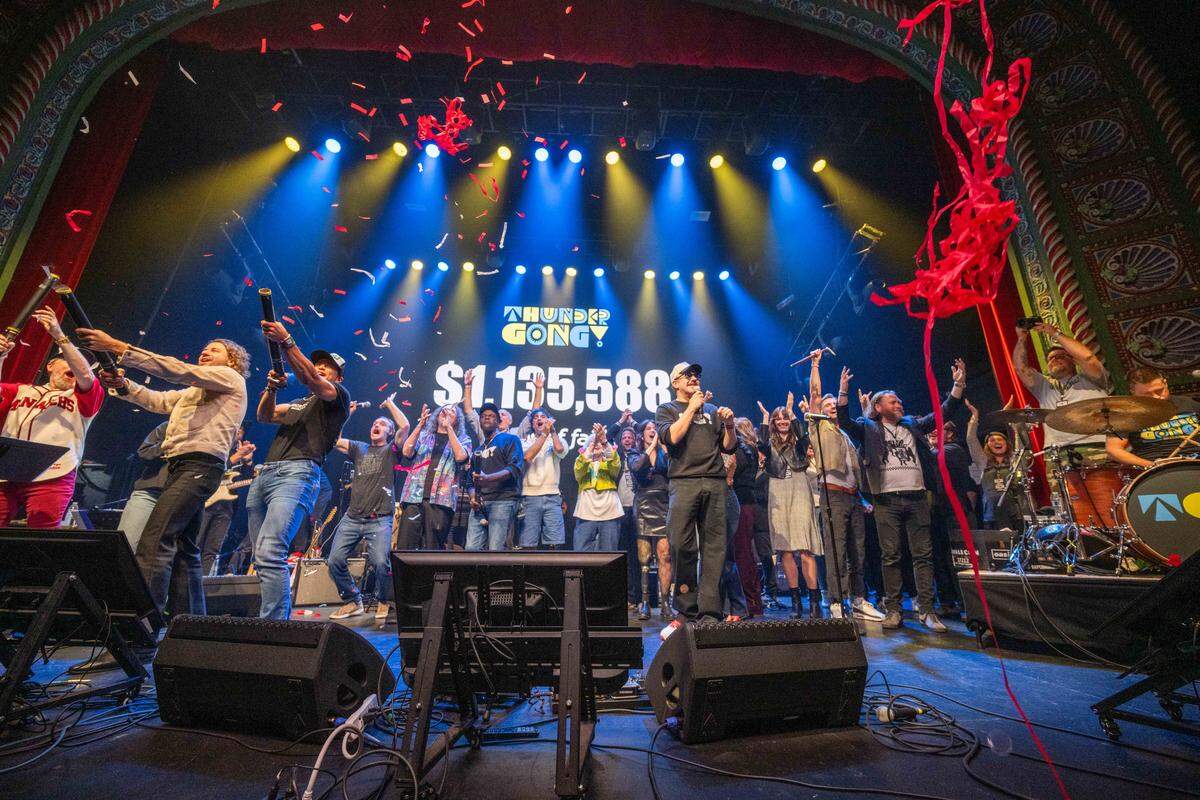 Performers and fans celebrate exceeding the fundraising goal for Thundergong! on Saturday, Nov. 8, at Uptown Theater in Kansas City. The annual fundraiser was hosted by Jason Sudeikis and featured live music performances and moments of comedy.