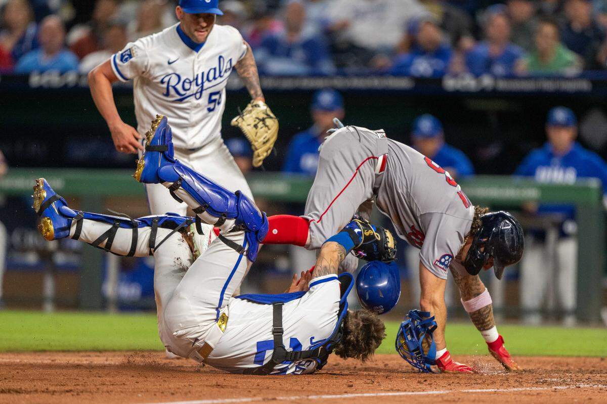 Kansas City Royals catcher Carter Jensen tags out Boston Red Sox left fielder Jarren Duran at home plate on Wednesday, May 20, 2026, at Kauffman Stadium.