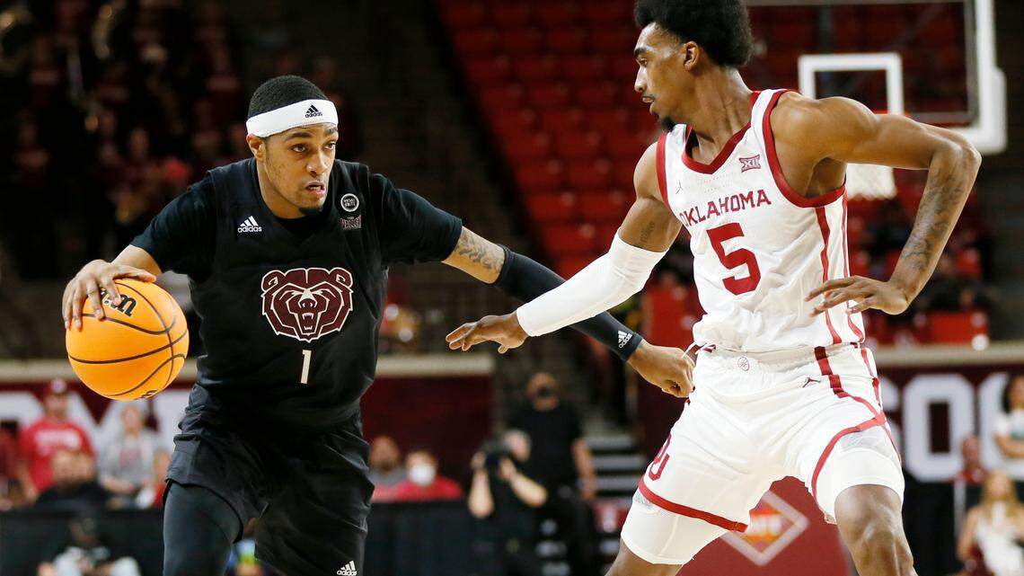 Missouri State guard Isiaih Mosley (1) dribbles next to Oklahoma guard Marvin Johnson (5) in the first half of a National Invitational Tournament college basketball game in Norman, Okla., Tuesday, March 15, 2022. (AP Photo/Nate Billings)