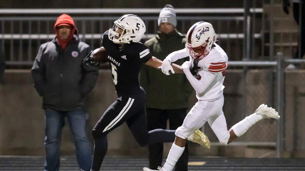 Blue Valley Northwest running back Grant Stubblefield races past an Olathe North defender on his way to a touchdown Friday night.