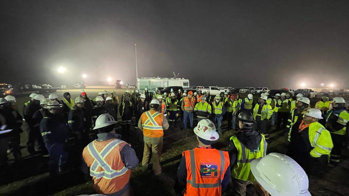 Oil spill cleanup crews from pipeline operator TC Energy gather at their morning briefing on Saturday, Dec. 10, 2022, in Washington County, Kansas.