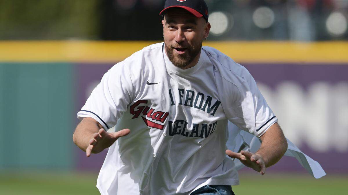 Kansas City Chiefs star Travis Kelce reacted after throwing out the first pitch before the game between the Cleveland Guardians and the Seattle Mariners at Progressive Field in 2023.