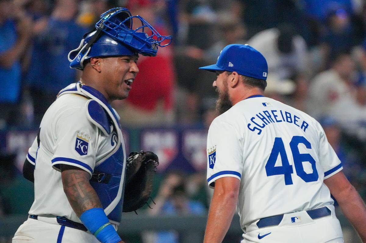Kansas City Royals relief pitcher John Schreiber, right celebrates Monday night’s win against the Los Angeles Angels with catcher Salvador Perez at Kauffman Stadium.