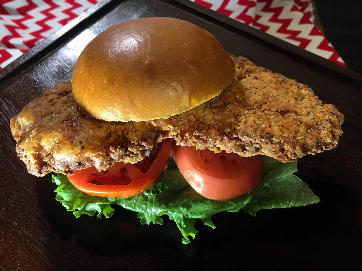 A large hand-breaded pork tenderloin sandwich on a brioche bun is among the new menu items offered in the Club Level at Arrowhead Stadium this year.