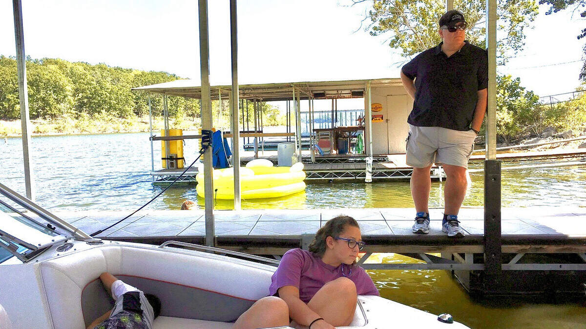 Olivia Copeland pictured with her father Mike Copeland during a family lake trip. Olivia Copeland died Saturday after she fell during a cliff climbing course in Idaho Springs, Colorado.
