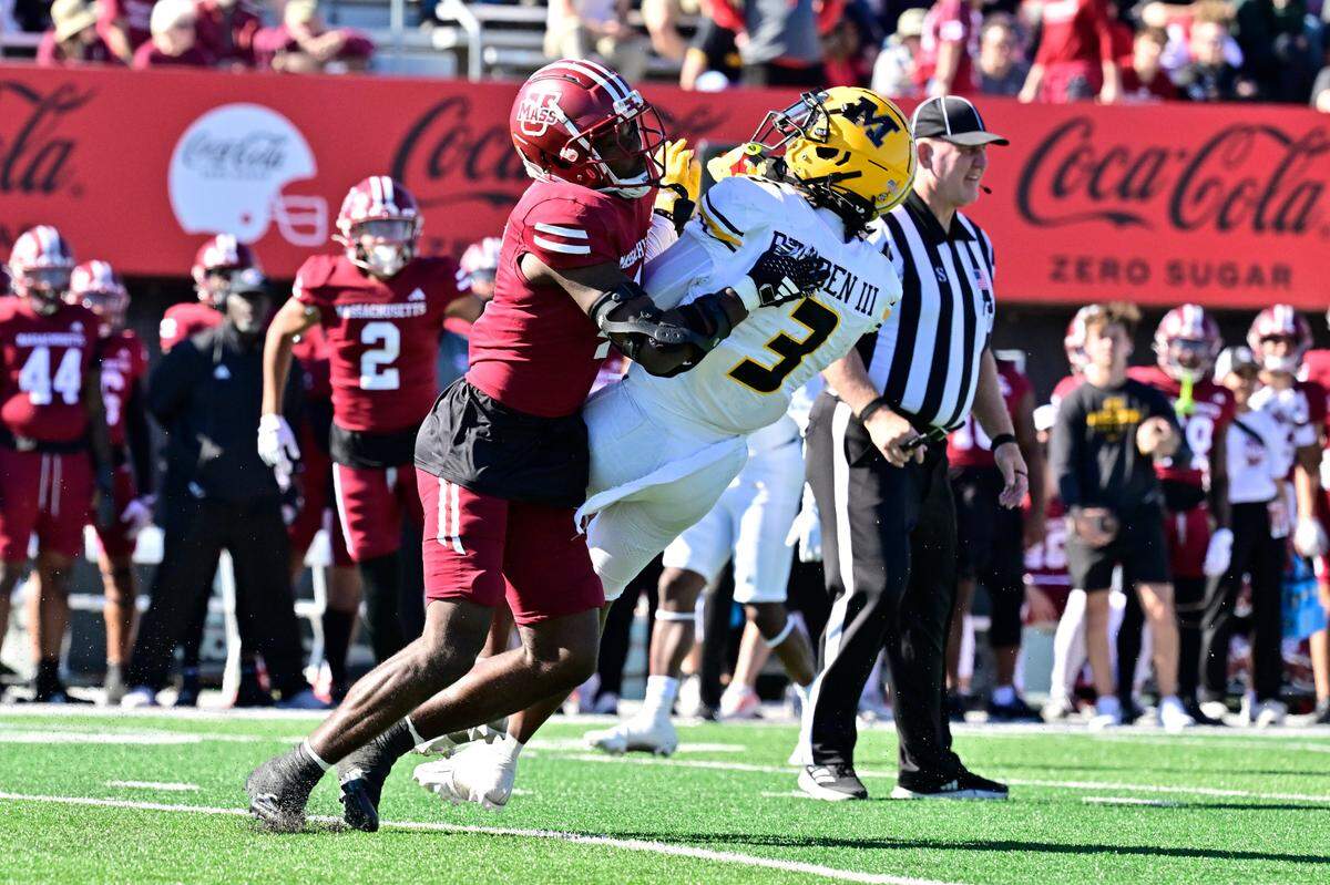 Massachusetts Minutemen safety Tyler Rudolph hits Missouri Tigers receiver Luther Burden III as Burden attempts to make a third-quarter catch during Saturday’s game at Warren McGuirk Alumni Stadium in Amherst, Mass.