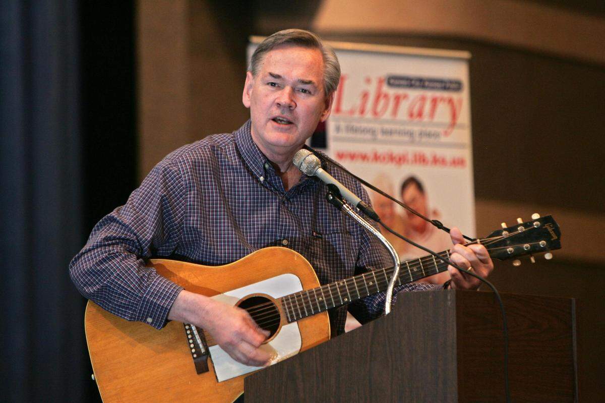 Congressman Dennis Moore took the stage to sing Woody Guthrie’s “This Land is Your Land” at Memorial Hall, 600 N. 7th St. in Kansas City, Kansas, on Tuesday, April 3, 2007. Moore died Tuesday at the age of 75.