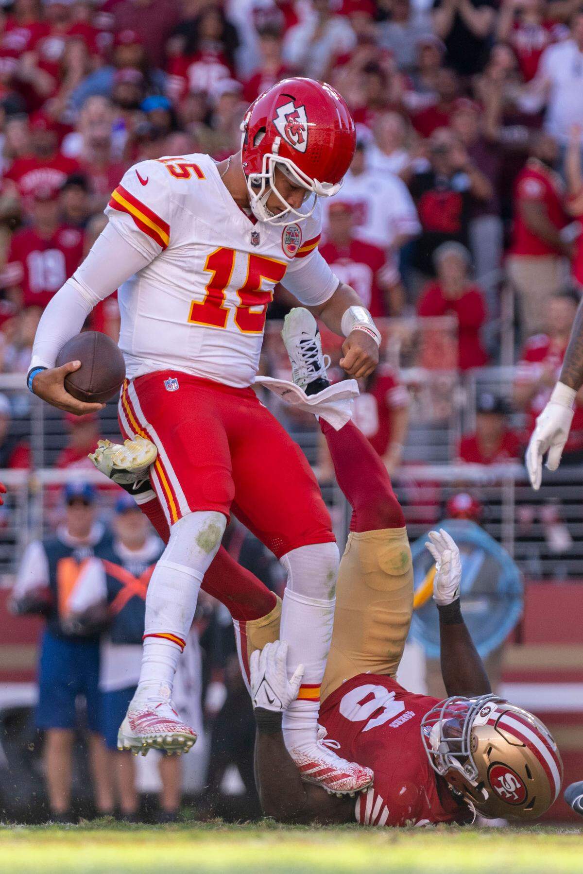 Kansas City Chiefs quarterback Patrick Mahomes (15) scores a touchdown against San Francisco 49ers safety Malik Mustapha (6) during the fourth quarter at Levi’s Stadium.