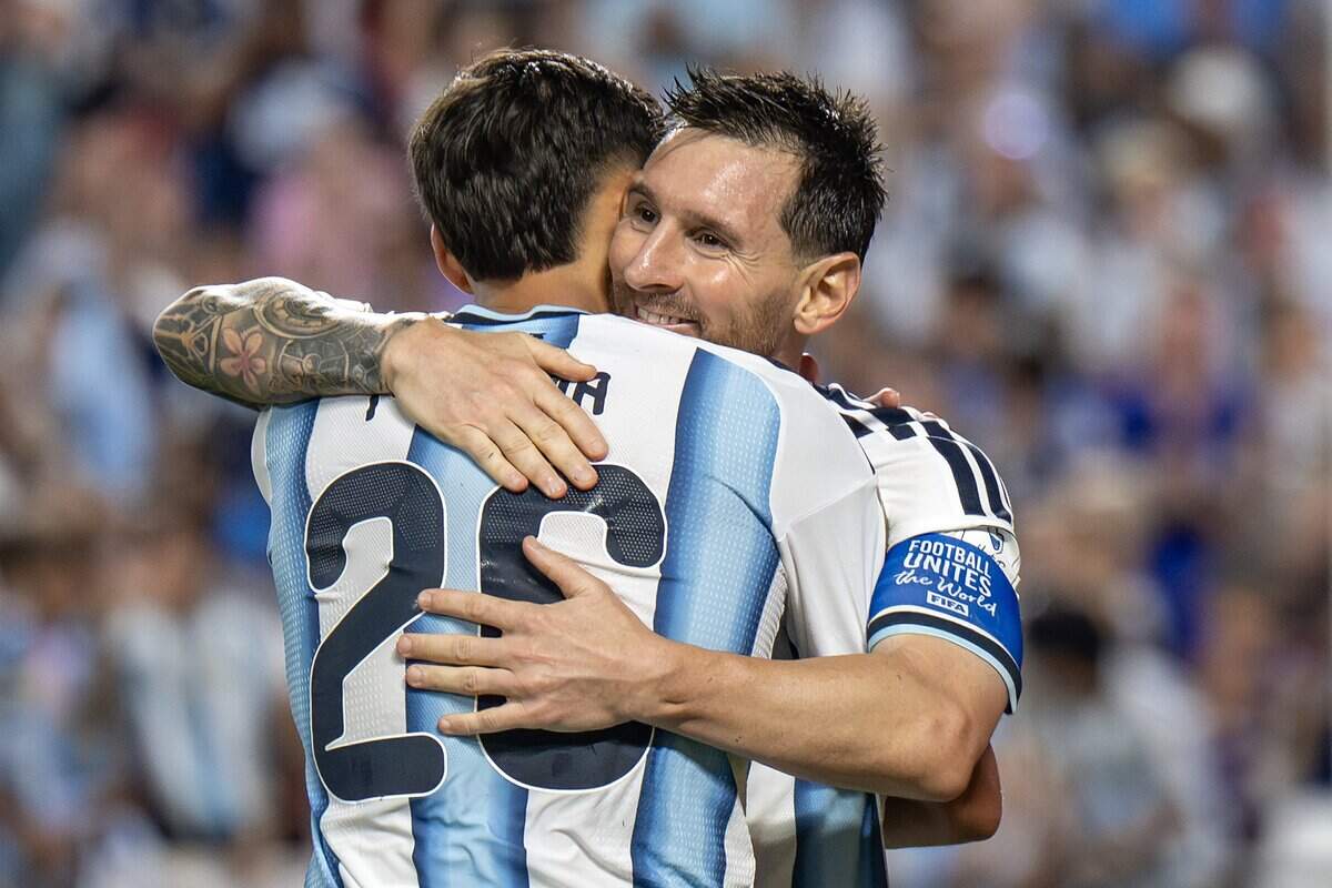 Argentina forward Lionel Messi (10) embraces teammate defender Nahuel Molina (26) after scoring his third goal in the second half of a FIFA World Cup group-stage soccer match against Algeria at Kansas City (Arrowhead) Stadium on Tuesday, June 16, 2026, in Kansas City.