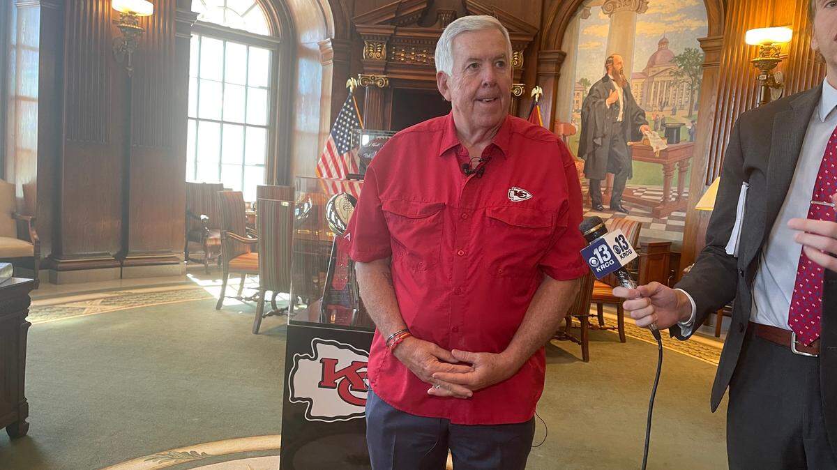 Missouri Gov. Mike Parson speaks with reporters in his Capitol office on June 27, 2024. Parson, a Republican, stood in front of the Lombardi trophies from the Chiefs recent Super Bowl victories.