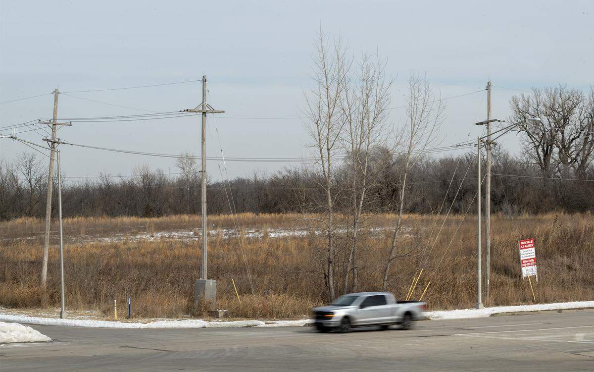  A vehicle travels west past a tract of undeveloped land for sale on northeast corner of State Avenue at N. 126th Street, where the Chiefs want to build a new stadium, pictured on Monday, Feb. 2.