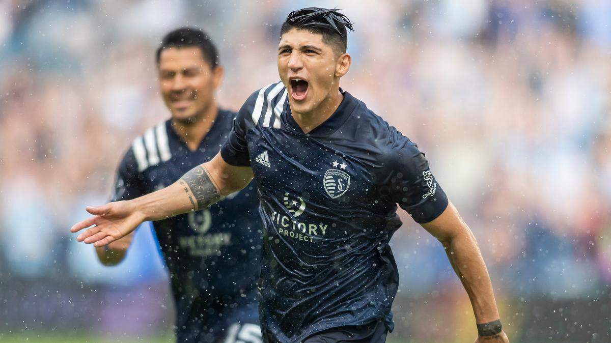 Sporting Kansas City forward Alan Pulido celebrates after scoring the tying goal during a match between Sporting Kansas City and Los Angeles FC on Saturday, June 26, 2021.