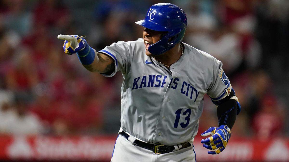 Kansas City Royals’ Salvador Perez (13) points to the dugout after hitting a home run during the eighth inning of a baseball game against the Los Angeles Angels in Anaheim, Calif., Monday, June 20, 2022. Andrew Benintendi also scored. (AP Photo/Ashley Landis)