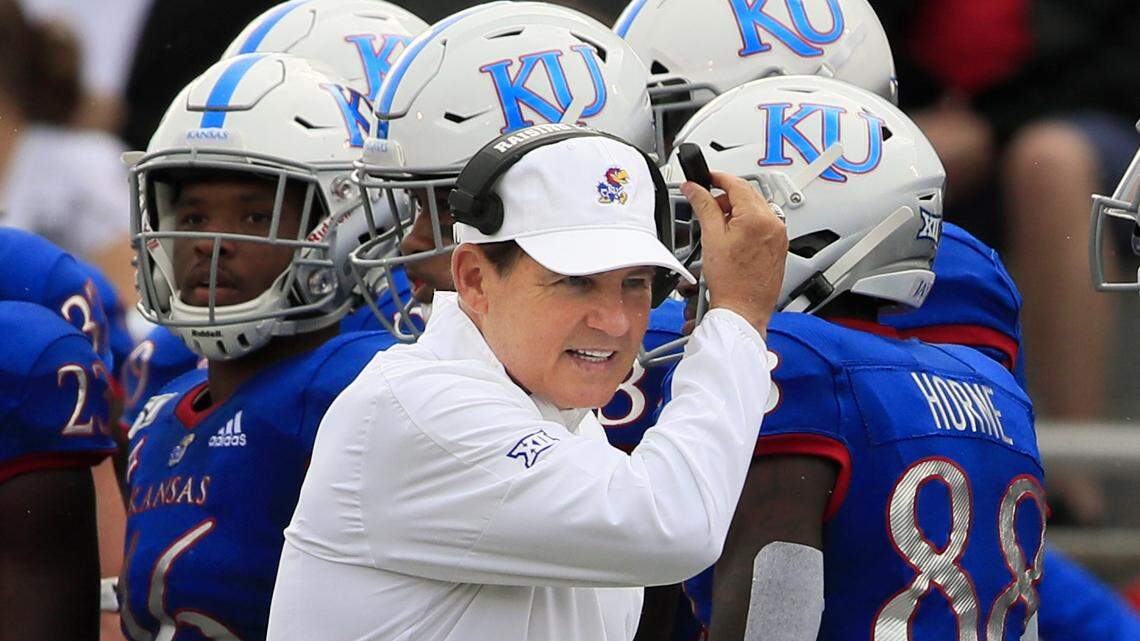 FILE - Kansas head coach Les Miles works the sidelines during the first half of an NCAA college football game against West Virginia in Lawrence, Kan., Saturday, Sept. 21, 2019. Coastal Carolina will visit the Jayhawks on Saturday night, Sept. 21, 2020, in the season opener for both teams. It’s the lone non-conference game for Kansas, which will have a week off before visiting Baylor to open its nine-game Big 12 slate — on the date that Coastal Carolina was originally supposed to face the Jayhawks at home. (AP Photo/Orlin Wagner, File)