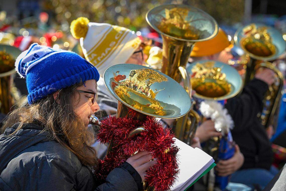 Decked out in their holiday finery, hundreds of local tuba and euphonium players gathered Tuesday in the Crown Center Square for their annual TubaChristmas holiday concert.