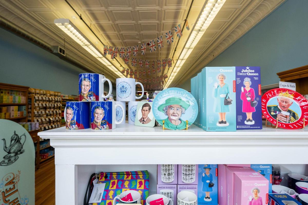 A lineup of items featuring members of the British royal family inside Brit’s, a shop that sells English imported items, in Lawrence on Wednesday, April 9, 2025. Helm says nearly 100% of her items come from Europe.